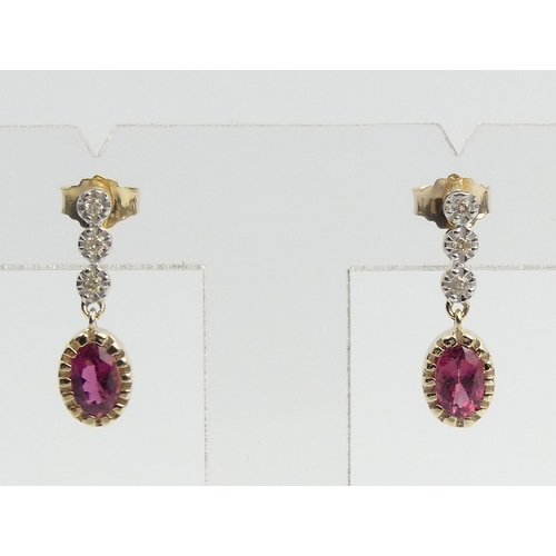 25 - A pair of 9ct gold rubellite and diamond earrings, 2 cm long. UK Postage £12.