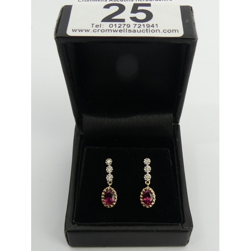 25 - A pair of 9ct gold rubellite and diamond earrings, 2 cm long. UK Postage £12.