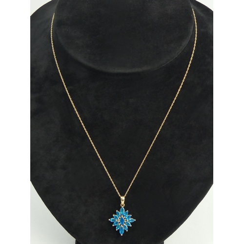 26 - A 9ct gold blue neon apatite cluster pendant and chain, 2.4 grams. 26 mm long. UK Postage £12.