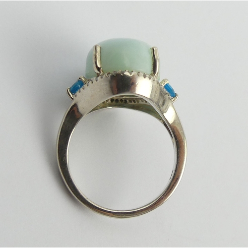 29 - Sterling silver blue stone and diamond ring, 6.7 grams. Size N, 18mm. UK Postage £12.