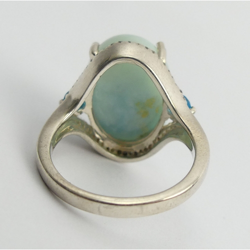 29 - Sterling silver blue stone and diamond ring, 6.7 grams. Size N, 18mm. UK Postage £12.