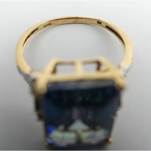 30 - 9ct gold mystic topaz and diamond ring, 4.2 grams. Size R 1/2, 14.3 mm. UK Postage £12.