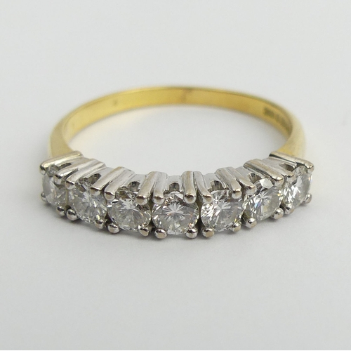 35 - 18ct gold seven stone diamond ring, 4.4 grams. Size S 1/2, 4 mm wide. UK Postage £12.