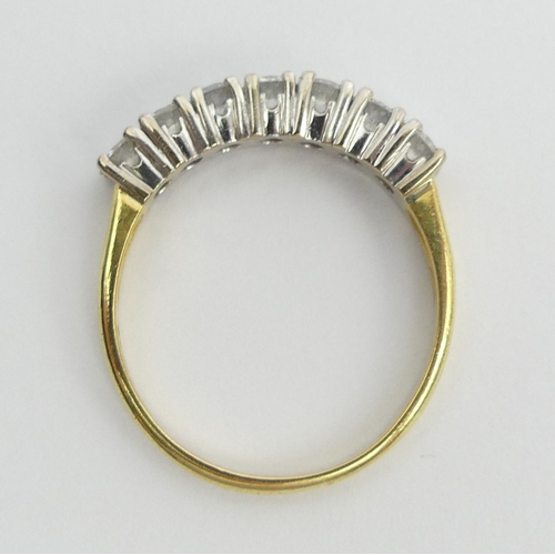 35 - 18ct gold seven stone diamond ring, 4.4 grams. Size S 1/2, 4 mm wide. UK Postage £12.