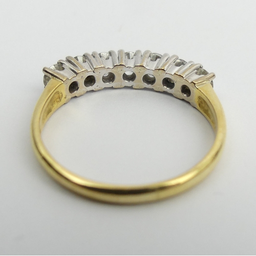 35 - 18ct gold seven stone diamond ring, 4.4 grams. Size S 1/2, 4 mm wide. UK Postage £12.