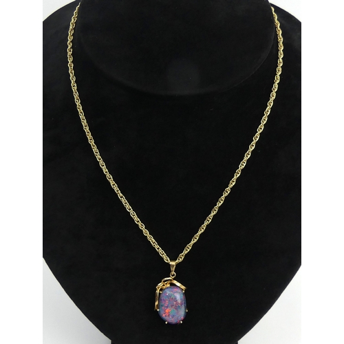 36 - 9ct gold opal doublet pendant and chain, 9.9 grams. Pendant 28 mm, chain 54 cm. UK Postage £12.