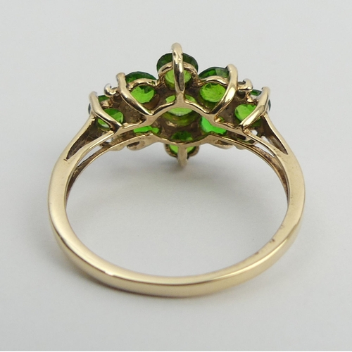 37 - 9ct gold chrome diopside ring, 2.4 grams. Size N, 12.3 mm wide. UK Postage £12.