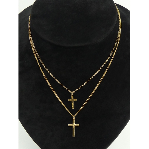 38 - Two 9ct gold cross pendants and chains, 5.9 grams. Chains 40 cm, pendants 22 mm. UK Postage £12.