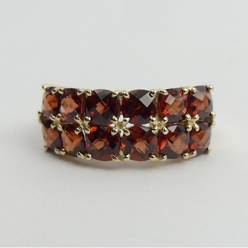 39 - 9ct gold garnet two row ring, 3.6 grams. Size N 1/2, 8.5 mm. UK Postage £12.