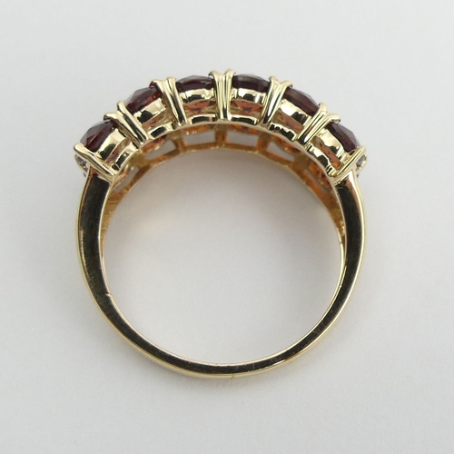 39 - 9ct gold garnet two row ring, 3.6 grams. Size N 1/2, 8.5 mm. UK Postage £12.