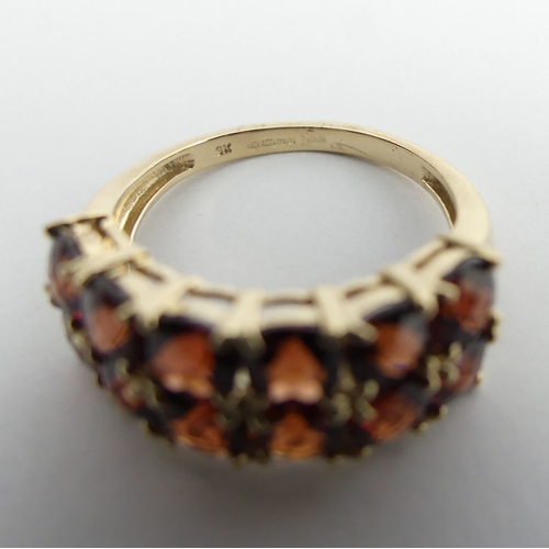 39 - 9ct gold garnet two row ring, 3.6 grams. Size N 1/2, 8.5 mm. UK Postage £12.