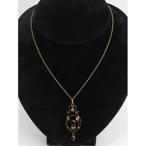 42 - 9ct gold garnet and seed pearl pendant and chain, chain 42 cm, pendant 52 mm. 4.9 grams. UK Postage ... 