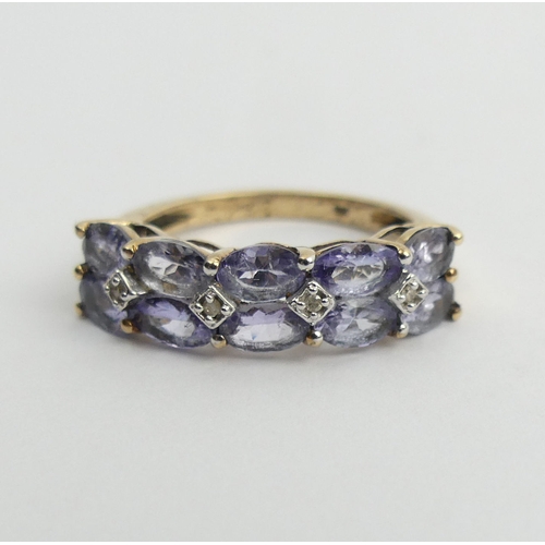 45 - 9ct gold tanzanite and diamond ring, 2.9 grams. Size N, 6.1 mm. UK Postage £12.