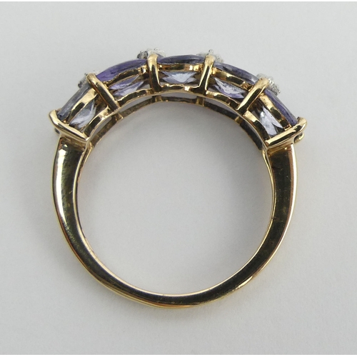 45 - 9ct gold tanzanite and diamond ring, 2.9 grams. Size N, 6.1 mm. UK Postage £12.