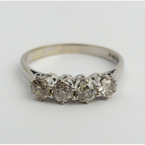 47 - 18ct white gold four stone diamond ring, 3.9 grams. Size T 1/2, 4.8 mm wide. UK Postage £12.