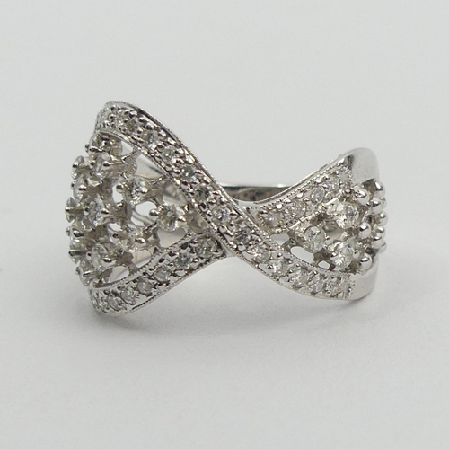 50A - Stylish design 18ct white gold diamond ring, 5.9 grams. Size N, 14.2 mm. UK Postage £12.