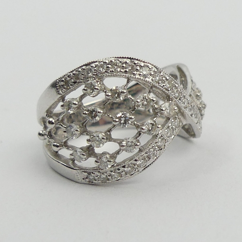 50A - Stylish design 18ct white gold diamond ring, 5.9 grams. Size N, 14.2 mm. UK Postage £12.