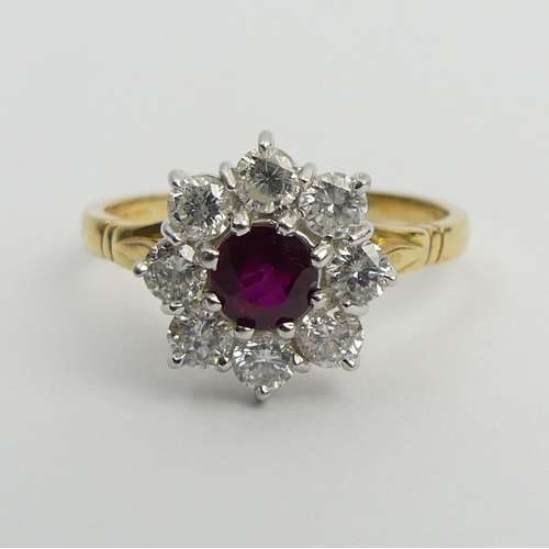 58 - 18ct gold ruby and diamond cluster ring, 4.9 grams. Size U, 13.4 mm. Centre stone approx 1/2ct, diam... 