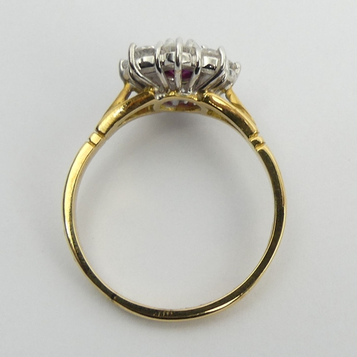 58 - 18ct gold ruby and diamond cluster ring, 4.9 grams. Size U, 13.4 mm. Centre stone approx 1/2ct, diam... 