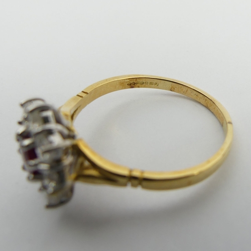 58 - 18ct gold ruby and diamond cluster ring, 4.9 grams. Size U, 13.4 mm. Centre stone approx 1/2ct, diam... 