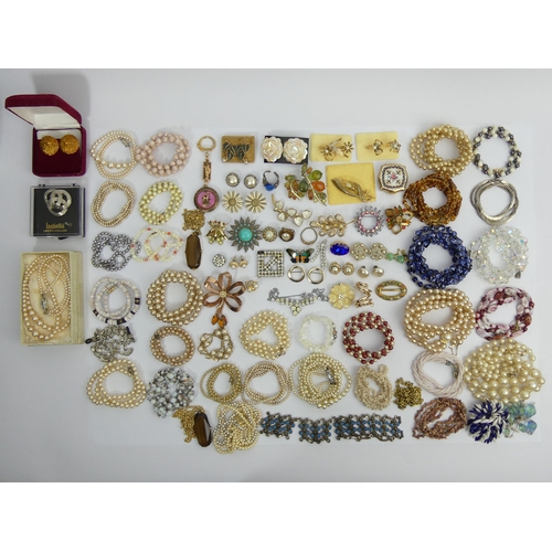 61 - A box of costume jewellery, including Murano bead and other necklaces. UK Postage £15.