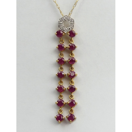 65A - 9ct gold diamond and ruby drop pendant and chain, 2.8 grams. Chain 41 cm, pendant 4.5 cm. UK Postage... 