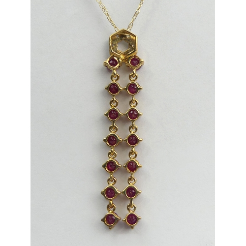 65A - 9ct gold diamond and ruby drop pendant and chain, 2.8 grams. Chain 41 cm, pendant 4.5 cm. UK Postage... 