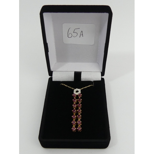 65A - 9ct gold diamond and ruby drop pendant and chain, 2.8 grams. Chain 41 cm, pendant 4.5 cm. UK Postage... 