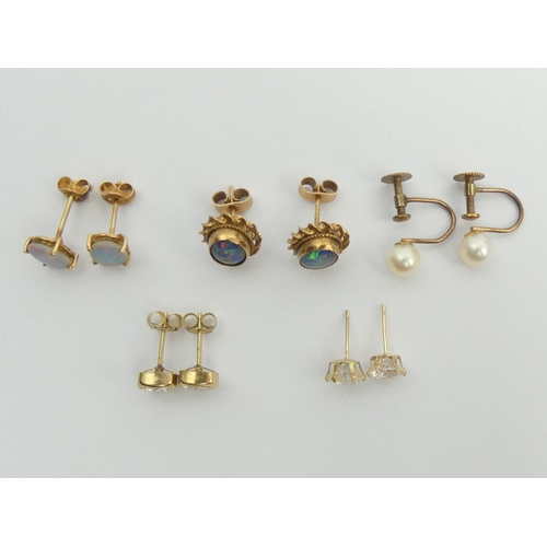 70 - Five pairs of 9ct gold earrings, two pairs set with opal doublets. 6.7 grams. UK Postage £12.