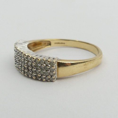 70A - 9ct gold diamond four row ring, 4.8 grams. Size Z + 2.5, 6.7 mm. UK Postage £12.