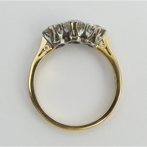 71 - 18ct gold three stone diamond ring (1.4 stamped inside). Size U, 6.2 mm. UK Postage £12.