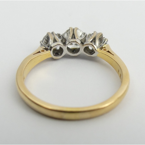 71 - 18ct gold three stone diamond ring (1.4 stamped inside). Size U, 6.2 mm. UK Postage £12.