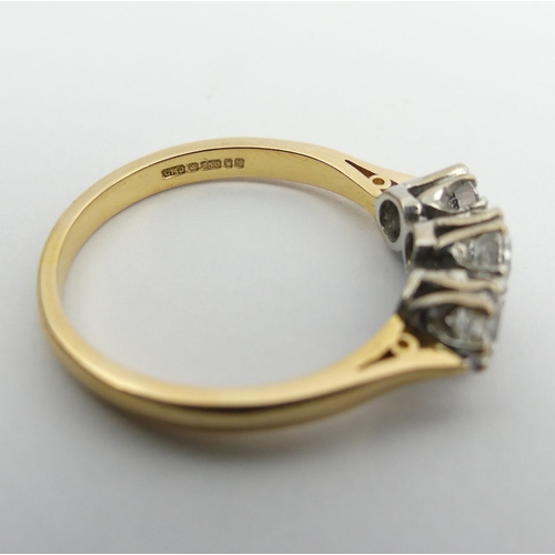 71 - 18ct gold three stone diamond ring (1.4 stamped inside). Size U, 6.2 mm. UK Postage £12.