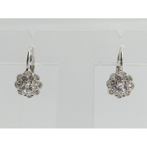 72 - A pair of 18ct gold white stone earrings, 3.3 grams. 16 mm long. UK Postage £12.