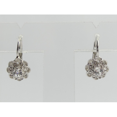 72 - A pair of 18ct gold white stone earrings, 3.3 grams. 16 mm long. UK Postage £12.