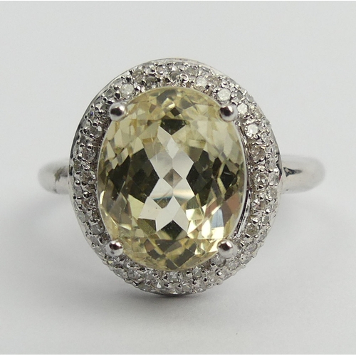 76 - 9ct white gold yellow kunzite & diamond ring, 3.9 grams. Size M 1/2, 15.2 mm. UK Postage £12.