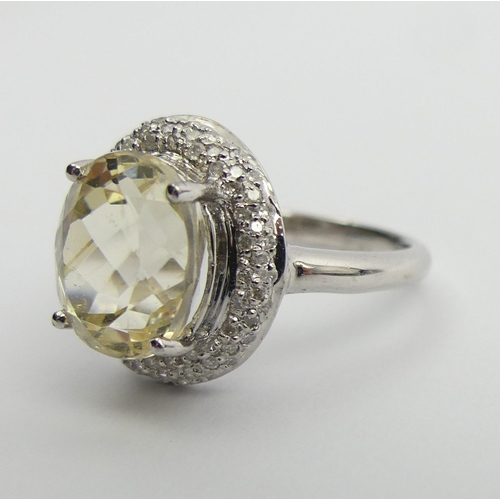 76 - 9ct white gold yellow kunzite & diamond ring, 3.9 grams. Size M 1/2, 15.2 mm. UK Postage £12.