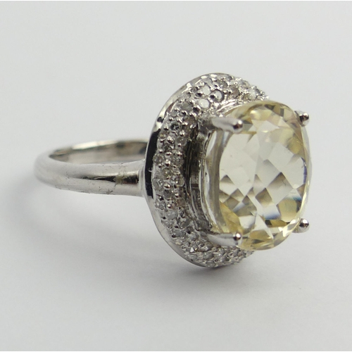 76 - 9ct white gold yellow kunzite & diamond ring, 3.9 grams. Size M 1/2, 15.2 mm. UK Postage £12.