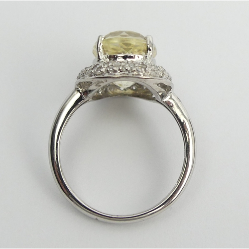 76 - 9ct white gold yellow kunzite & diamond ring, 3.9 grams. Size M 1/2, 15.2 mm. UK Postage £12.