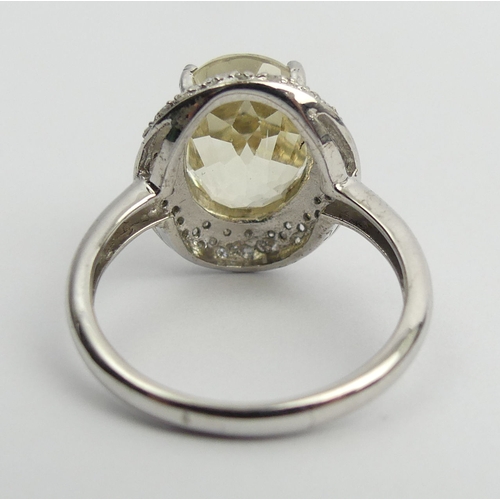 76 - 9ct white gold yellow kunzite & diamond ring, 3.9 grams. Size M 1/2, 15.2 mm. UK Postage £12.