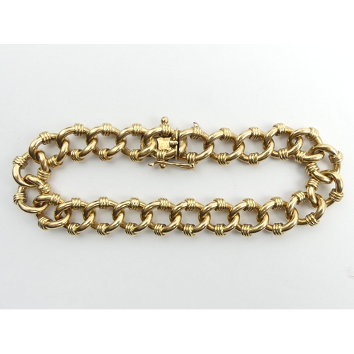 78 - 9ct gold fancy solid curb link bracelet, 55.4 grams. 22.5 cm x 12.6 mm. UK Postage £12.