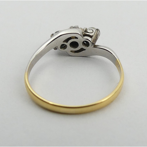 80A - 18ct gold and platinum diamond three stone ring, 2.1 grams. Size L, 6 mm wide. UK Postage £12.