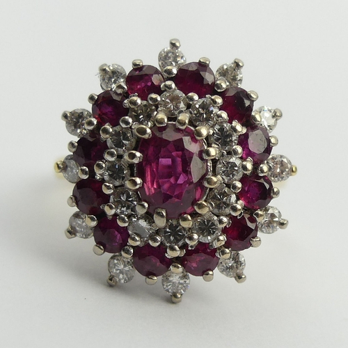 81 - 18ct gold ruby and diamond cluster ring, 7.6 grams. Size N, 18.6 mm wide. UK Postage £12.