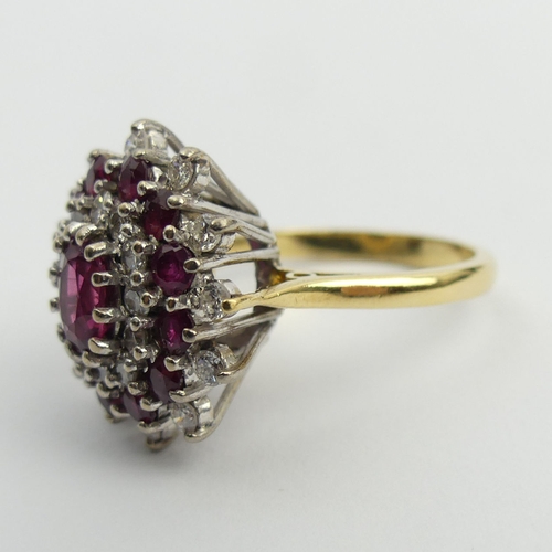 81 - 18ct gold ruby and diamond cluster ring, 7.6 grams. Size N, 18.6 mm wide. UK Postage £12.