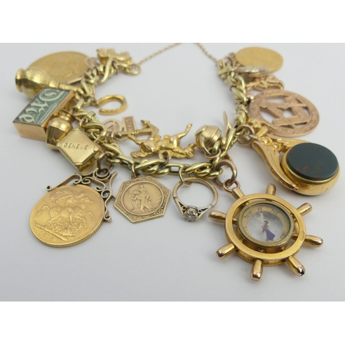 86 - 14ct gold charm bracelet with an 1887 two pound piece and two 1913 sovereigns, along with a compass ... 