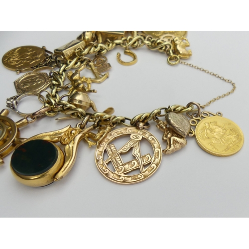 86 - 14ct gold charm bracelet with an 1887 two pound piece and two 1913 sovereigns, along with a compass ... 