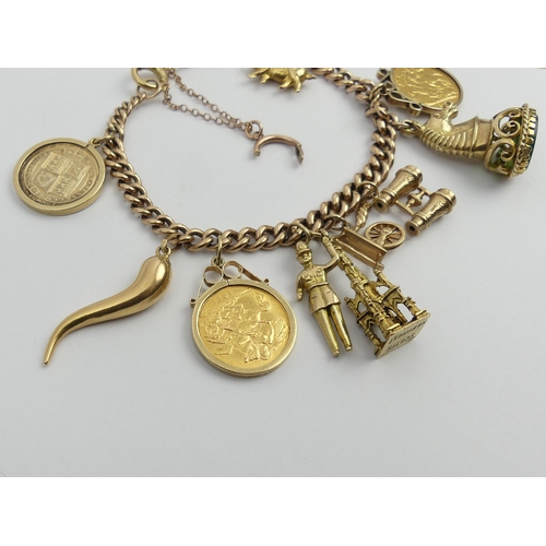 87 - 9ct gold charm bracelet with a 1900 and a 1911 half sovereign among other charms. 51 grams. UK Posta... 