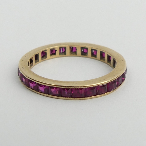 90 - 9ct gold (tested) ruby? full eternity ring, 2.1 grams. Size N 1/2, 2.8 mm. UK Postage £12.