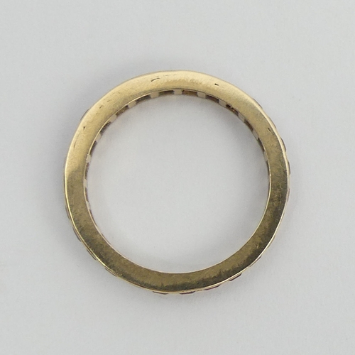 90 - 9ct gold (tested) ruby? full eternity ring, 2.1 grams. Size N 1/2, 2.8 mm. UK Postage £12.