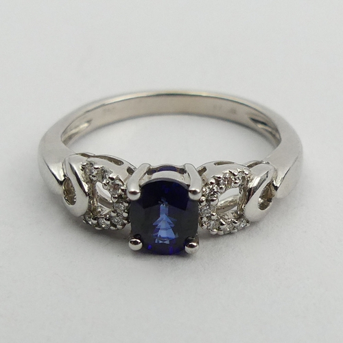 90A - 18ct white gold sapphire and diamond ring, 3 grams. Size K 1/2, 5.4 mm wide. UK Postage £12.